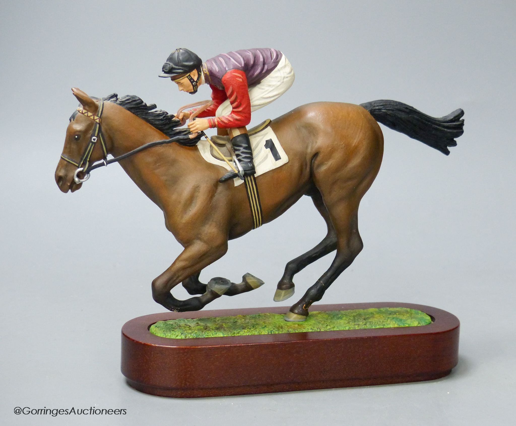 A Cameron Sculptures cold-painted bronze model of a racehorse with jockey up, height 16.5cm